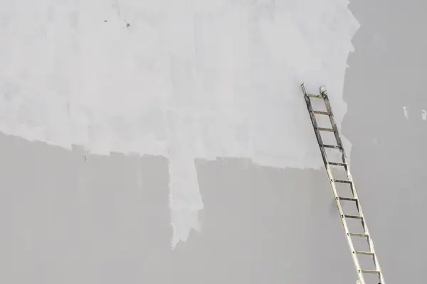 Exterior painting in Greensboro: ladder against a freshly primed wall